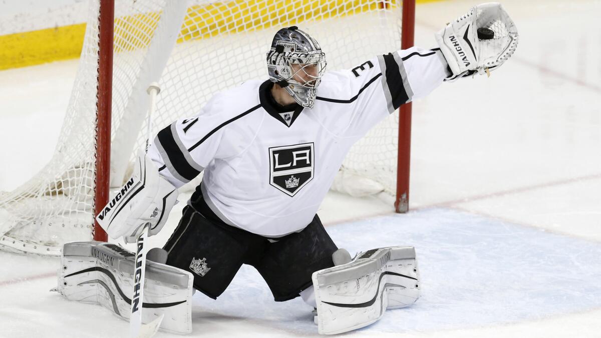 Kings goalie Martin Jones makes a glove save during the first period of a 4-1 loss to the Minnesota Wild on Saturday.