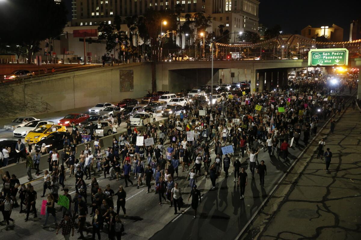 Anti-Trump protesters march on the 101 Freeway near downtown Los Angeles on Nov. 9, 2016.