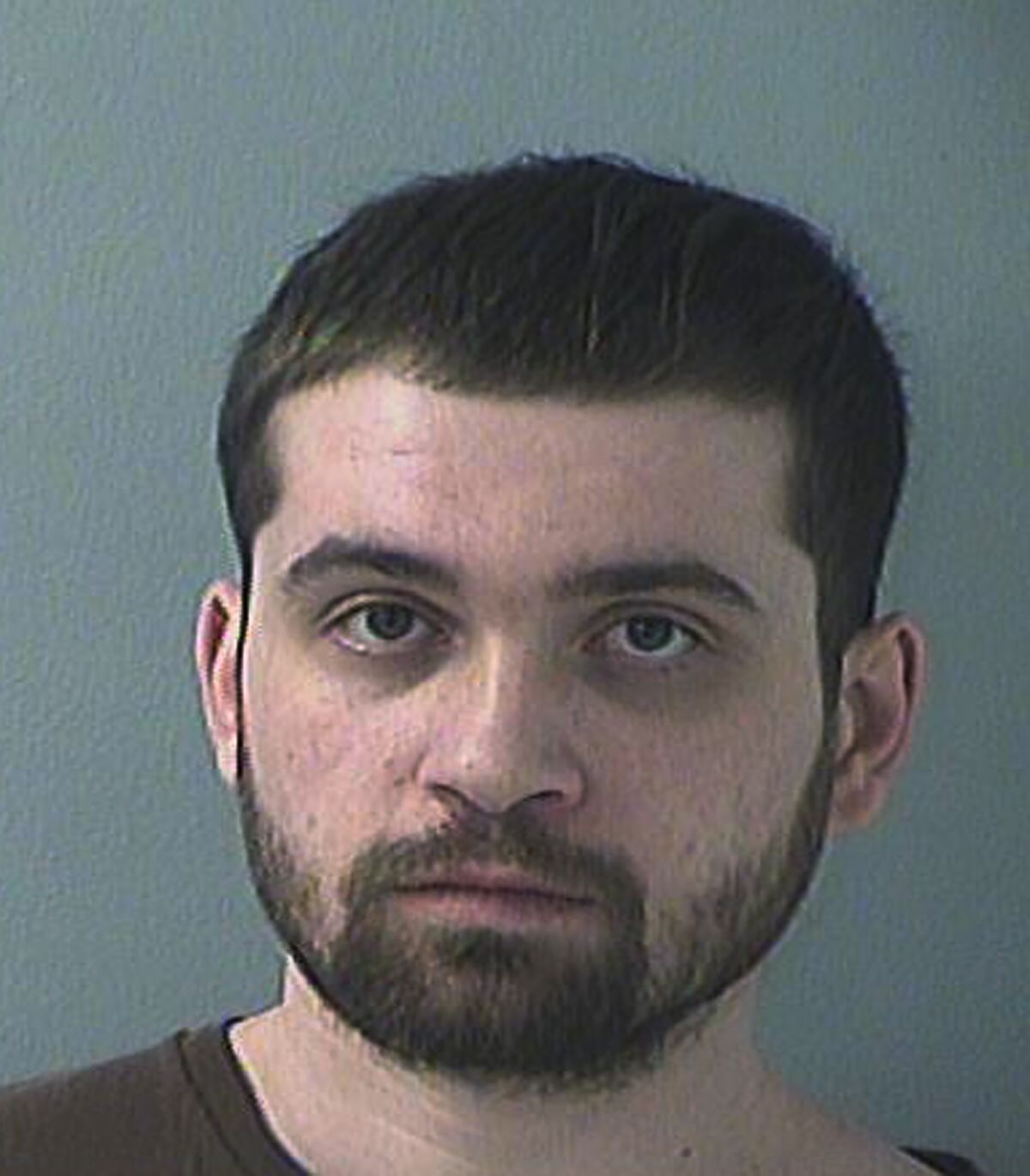FILE - This 2019 photo provided by the Butler County (Ohio) Jail shows Brian Rini in Hamilton, Ohio. A federal judge plans to complete sentencing Tuesday, Dec. 15, 2020 for an Ohio man who falsely claimed to be a long-missing Illinois child. Rini, now 25, was initially sentenced earlier this year to two years behind bars. But the judge wanted to see results of a pre-sentencing investigation, likely including details of Rini's mental and physical conditions, before officially entering his sentence. (Butler County (Ohio) Jail via AP, File)