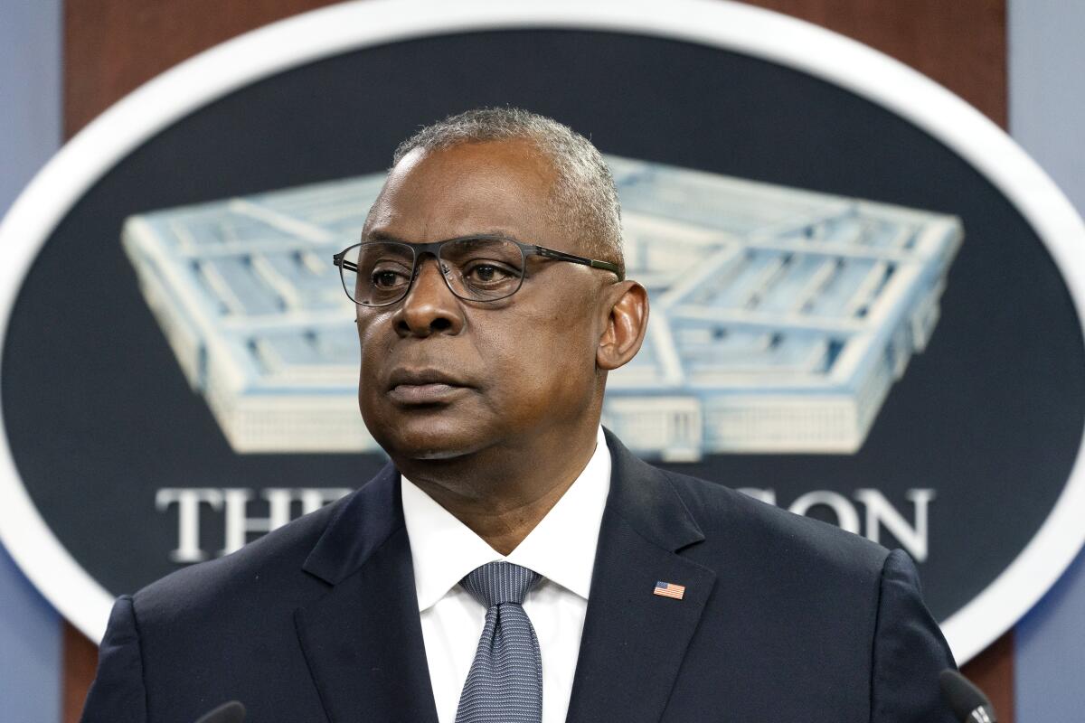 Secretary of Defense Lloyd Austin pauses while speaking during a media briefing at the Pentagon