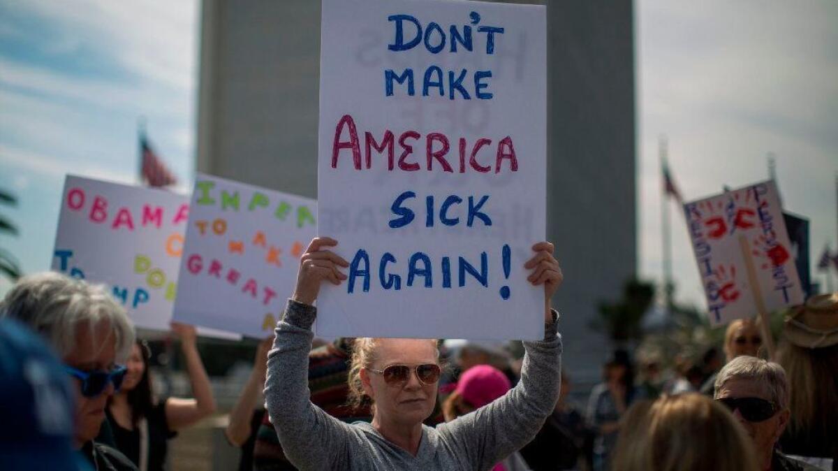 Demonstrators protest Trump administration efforts to repeal Obamacare in Washington in 2017.