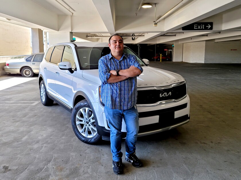 Uber driver and IT technician Ben Valdez with his Kia Telluride, which costs about $120 to fill up.
