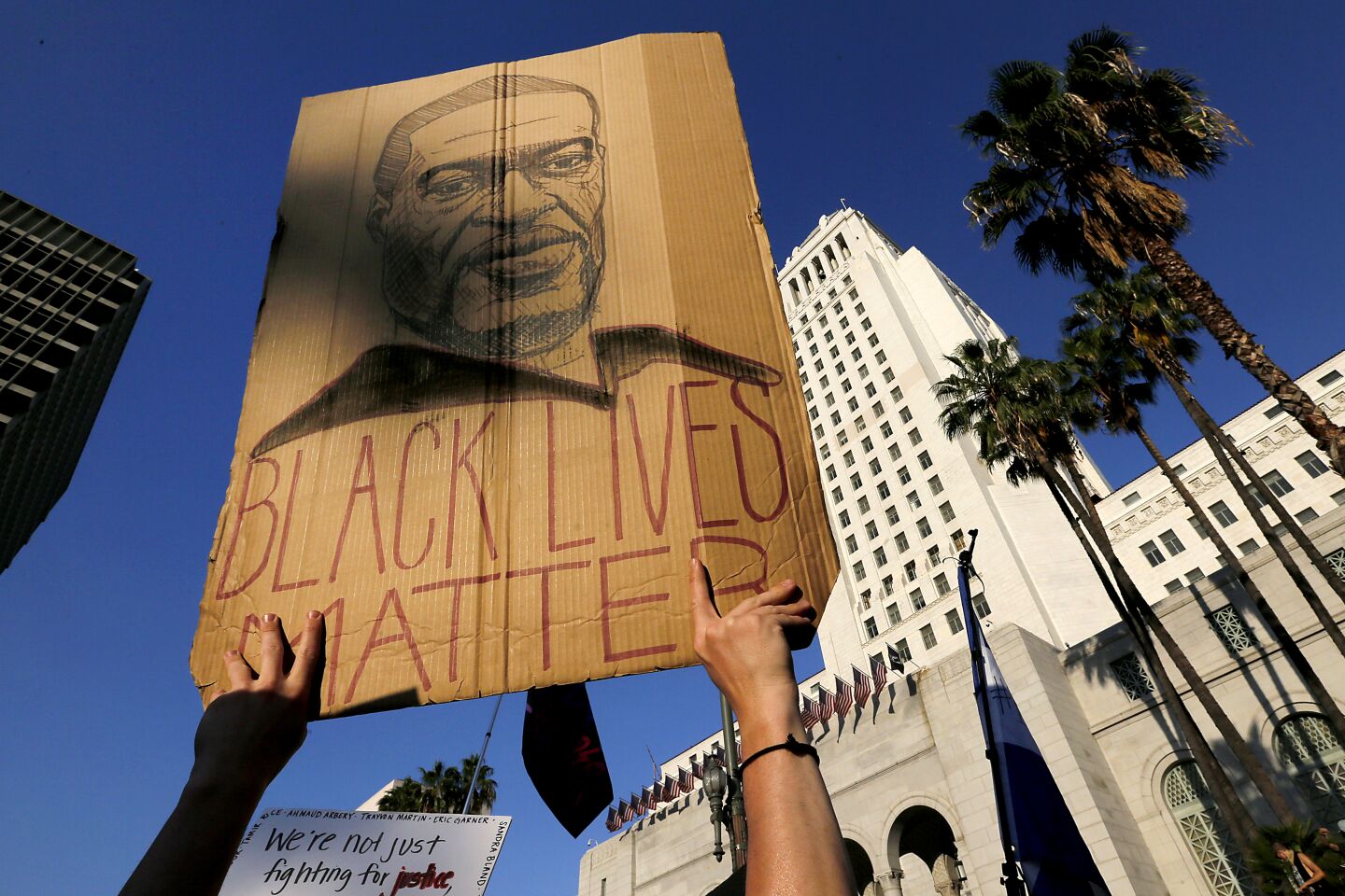 Protesters gather at the Los Angeles Civic Center to demonstrate for justice and against police brutality.