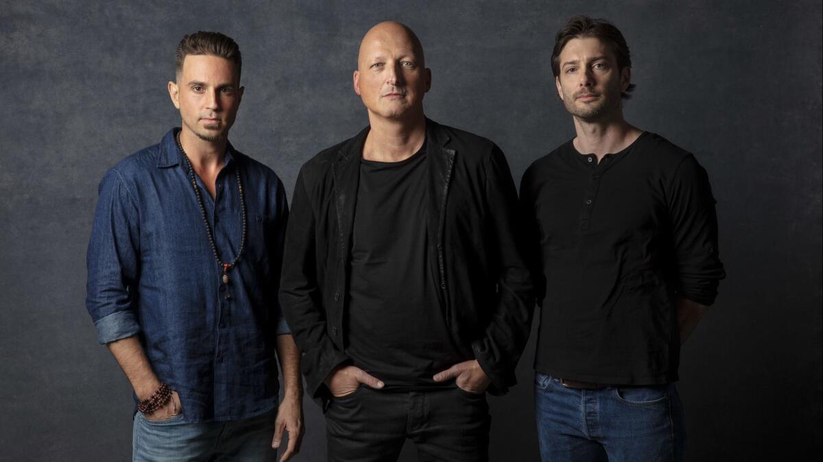 Wade Robson, left, director Dan Reed, and James Safechuck from the documentary "Leaving Neverland," which premiered at Sundance on Friday.