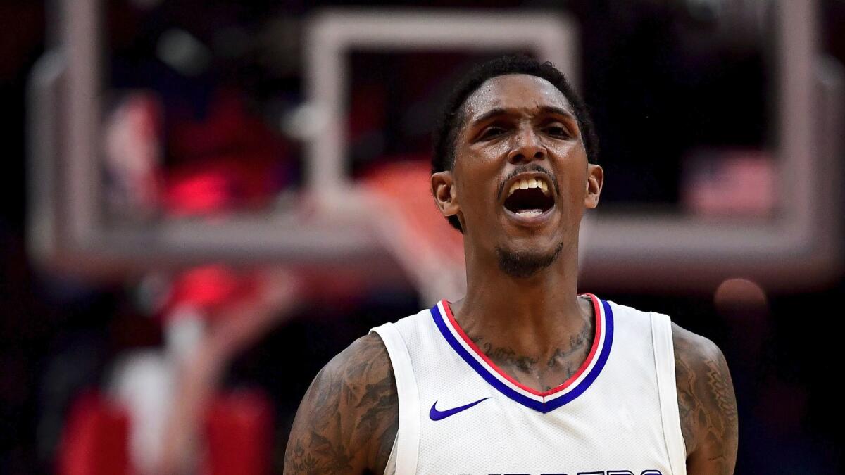 Clippers' Lou Williams celebrates after hitting a three-pointer during a 109-105 loss to Philadelphia on Nov. 13.