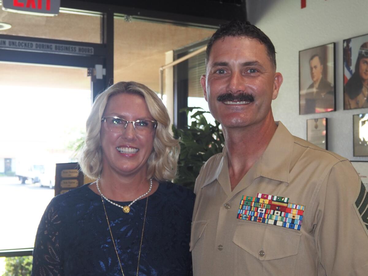 Last year's winner, Kyp Hughes, with her husband, Master Gunnery Sgt. Shawn Hughes.