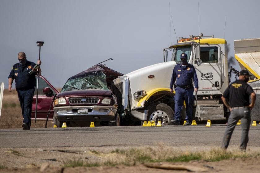 HOLTVILLE, CA - MARCH 2, 2021: CHP investigates the scene where an SUV carrying 25 people collided with a semi-truck killing 13 on Highway 115 near the Mexican border on March 2, 2021 in Holtville, California. All the back seats had beens stripped from the vehicle. The passengers in the SUV ranged in age from 15-53.(Gina Ferazzi / Los Angeles Times)