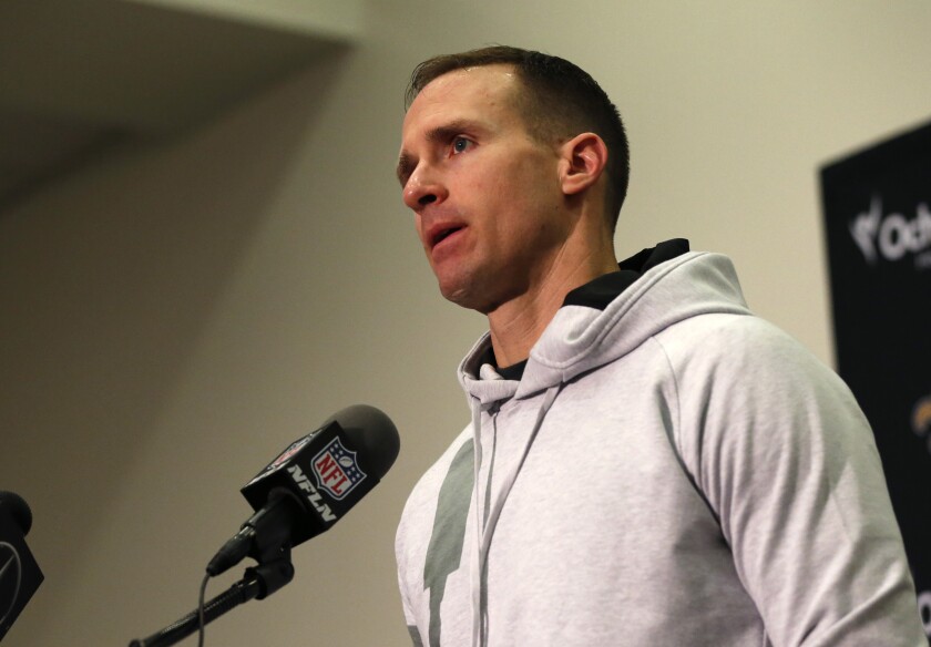 New Orleans Saints quarterback Drew Brees talks to reporters in January.