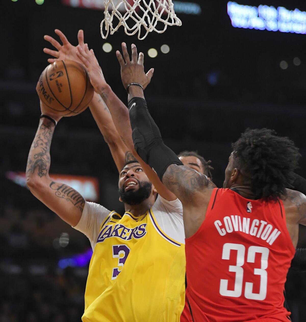 Houston's Robert Covington guards the Lakers' Anthony Davis.