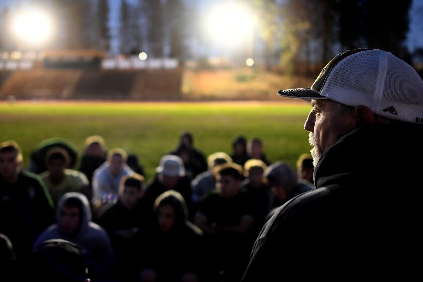 PARADISE, CALIFORNIA NOVEMBER 15, 2019-Paradise High School head coach Rick Prinz talks to his players after a light practice in preparation for a playoff game against West Valley High School. (Wally Skalij/Los Angerles Times)
