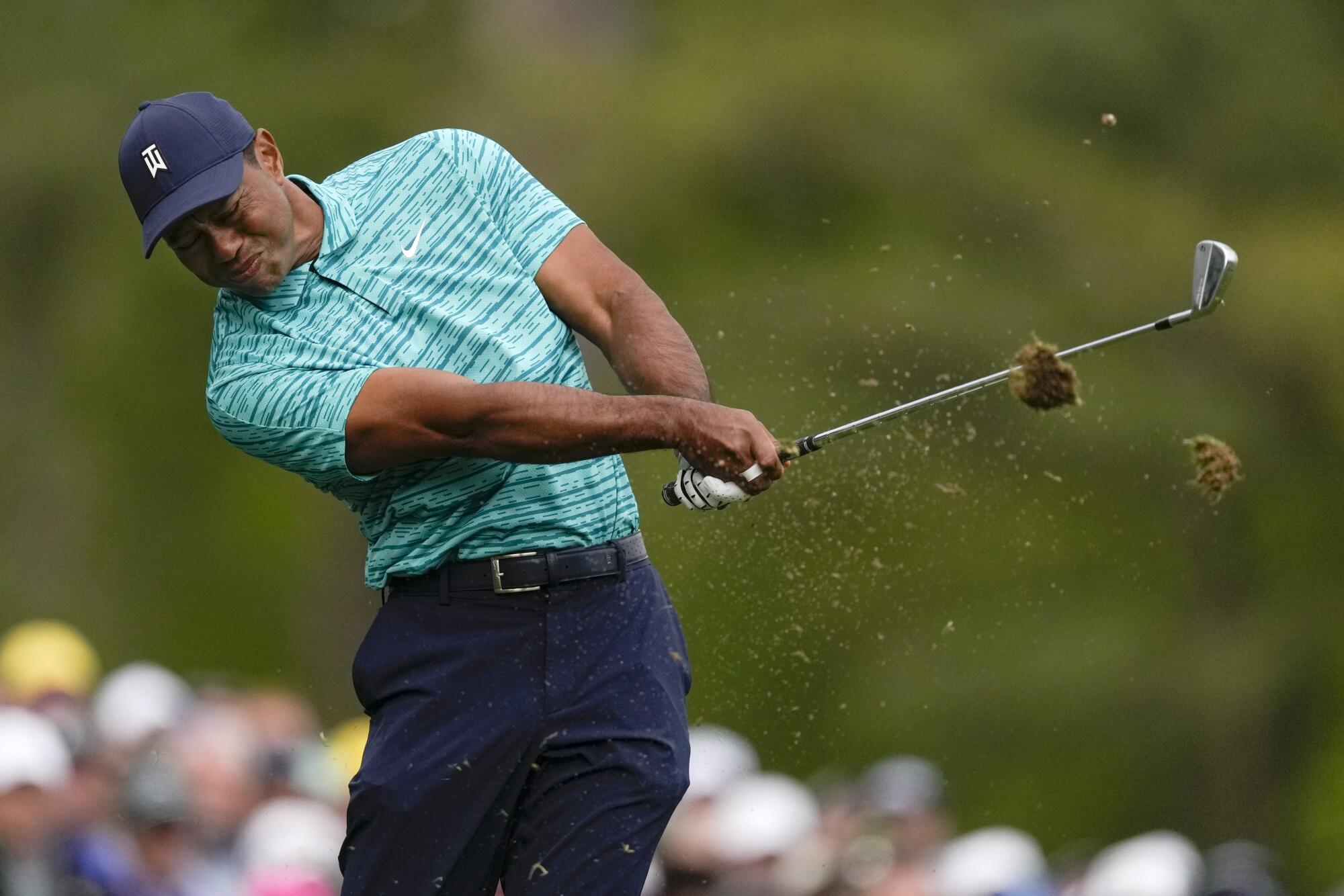 Tiger Woods hits on the 12th hole during the second round at the Masters golf tournament.