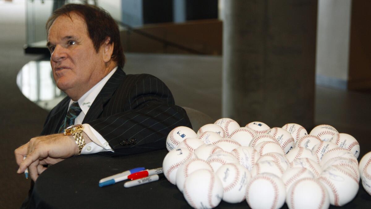 Former Cincinnati Reds great Pete Rose talks with guests before speaking at a gala in Cincinnati in 2011. He has again applied for reinstatement to Major League Baseball.