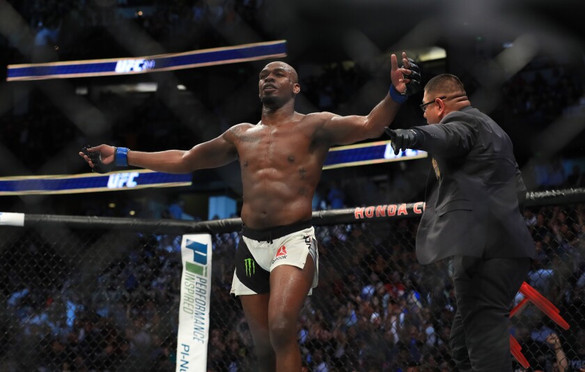 Jon Jones celebrates after stopping Daniel Cormier in the third round of their light-heavyweight title fight at UFC 214 on July 29 at Honda Center.