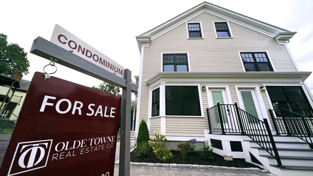 FILE - Condominium units are offered for sale in the Dorchester neighborhood, Wednesday, Aug. 18, 2021, in Boston. Rising interest rates are making adjustable-rate mortgages a more attractive alternative to common 30-year, fixed-rate home loans. (AP Photo/Charles Krupa, File)