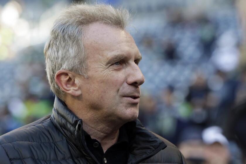 Former San Francisco 49ers quarterback Joe Montana stands on the sideline before a game between the 49ers and Seattle Seahawks in December.