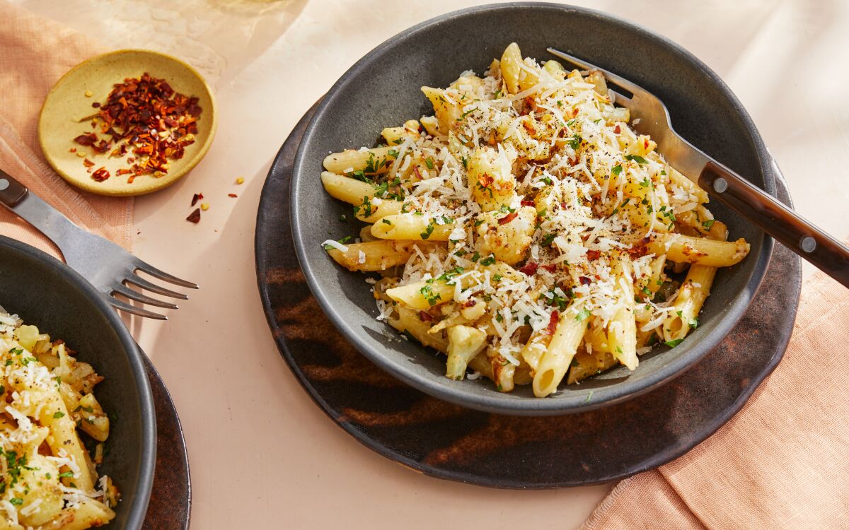 Caramelized cauliflower adds depth to a simple pasta, teeming with garlic and chile flakes. 