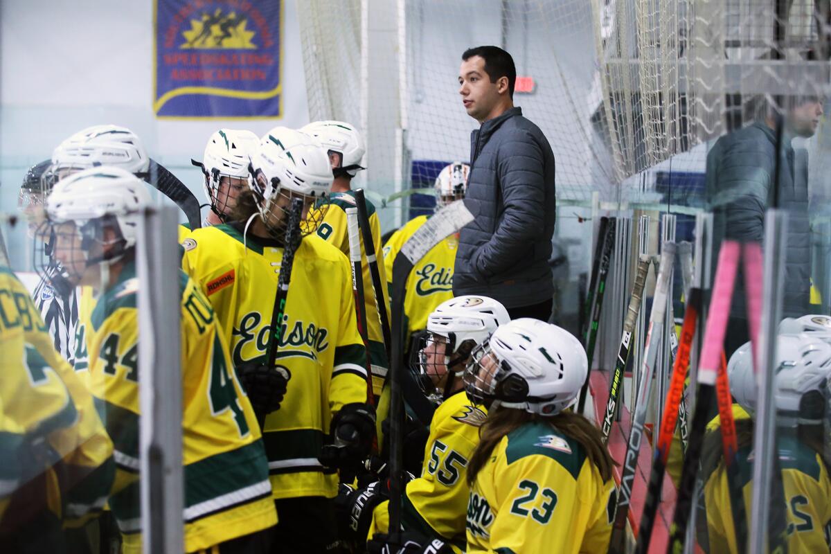 Edison coach Tyler Wilkerson watches his team against Beach Cities at the Rinks Lakewood Ice on Sept. 24.