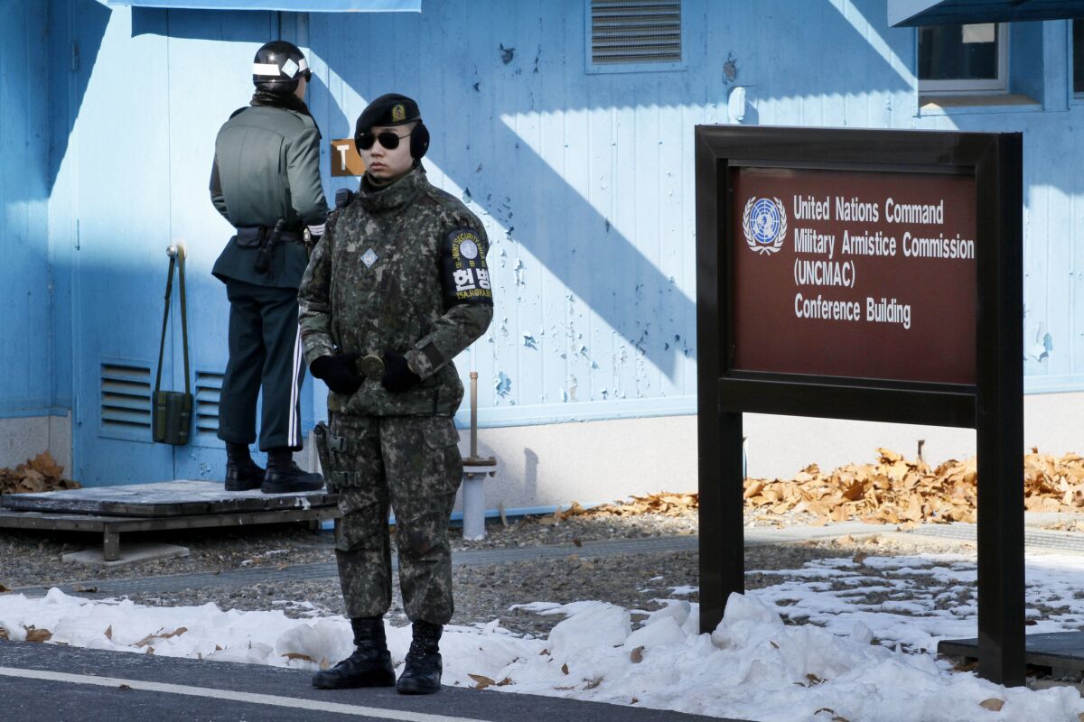 A South Korean soldier and military police officer at the Joint Security Area.