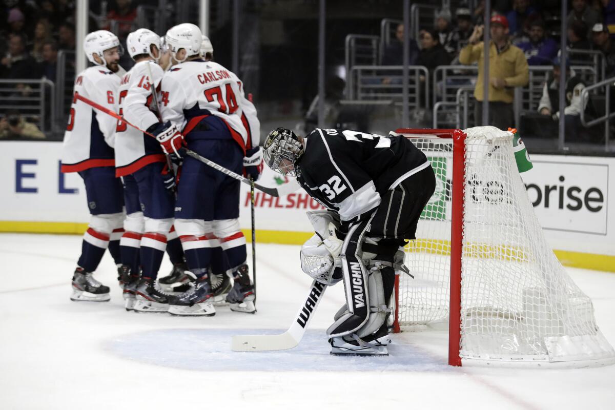 Kings goaltender Jonathan Quick looks down after giving up a goal to Capitals defenseman John Carlson (74) during the first period of a game Dec. 4 at Staples Center.