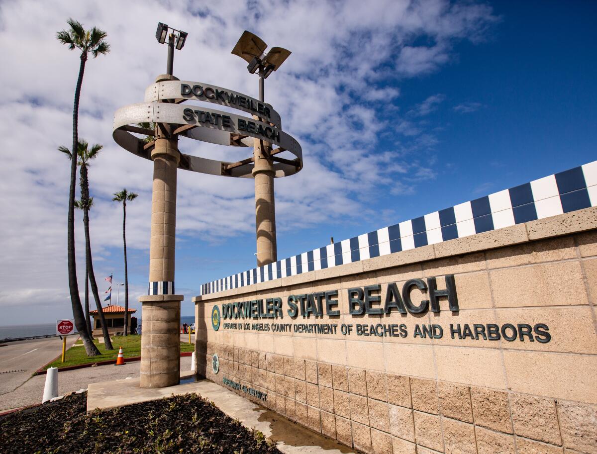 A sign marks the entrance to Dockweiler State Beach.
