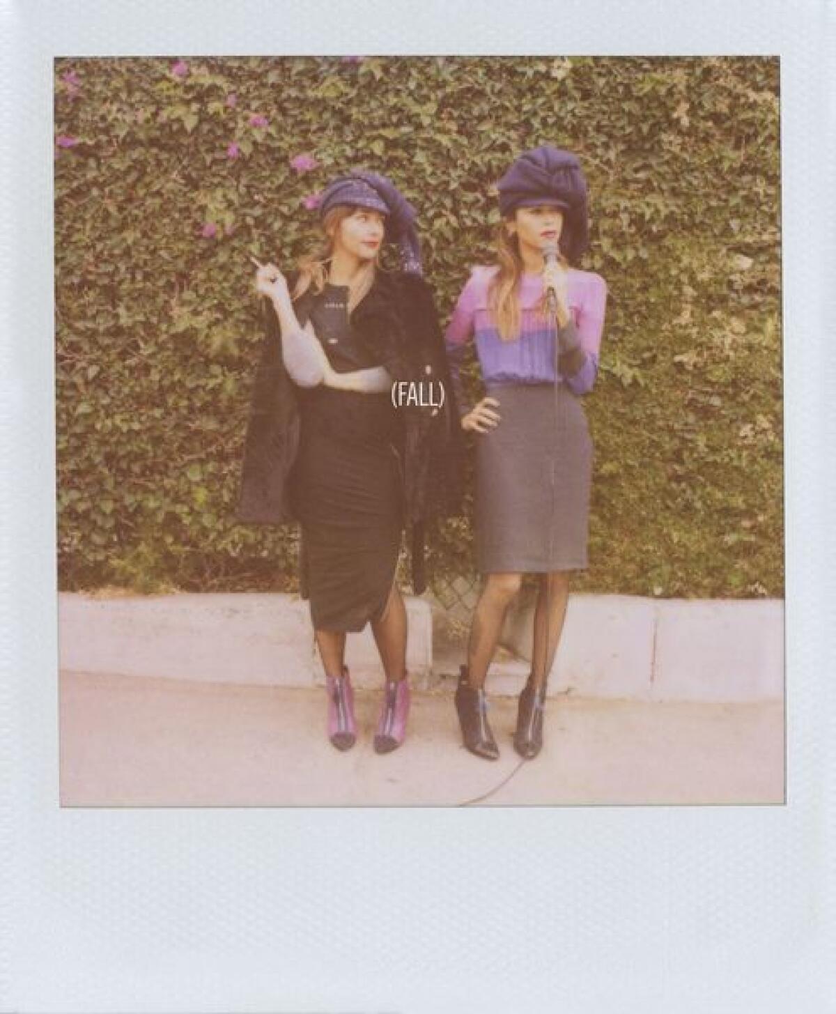 The Band of Outsiders fall 2013 women's ad campaign, featuring sisters Rashida, left, and Kidada Jones was shot using a Polaroid camera at the Dresden Restaurant in Los Angeles.