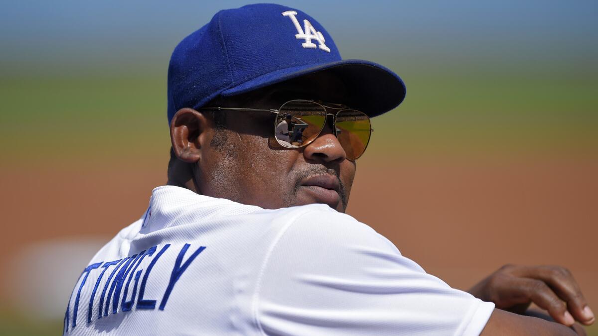 Dodgers third baseman Juan Uribe looks on during Sunday's regular-season finale against the Colorado Rockies. Uribe served as the team's acting manager for Manager Don Mattingly, who gave himself the day off.