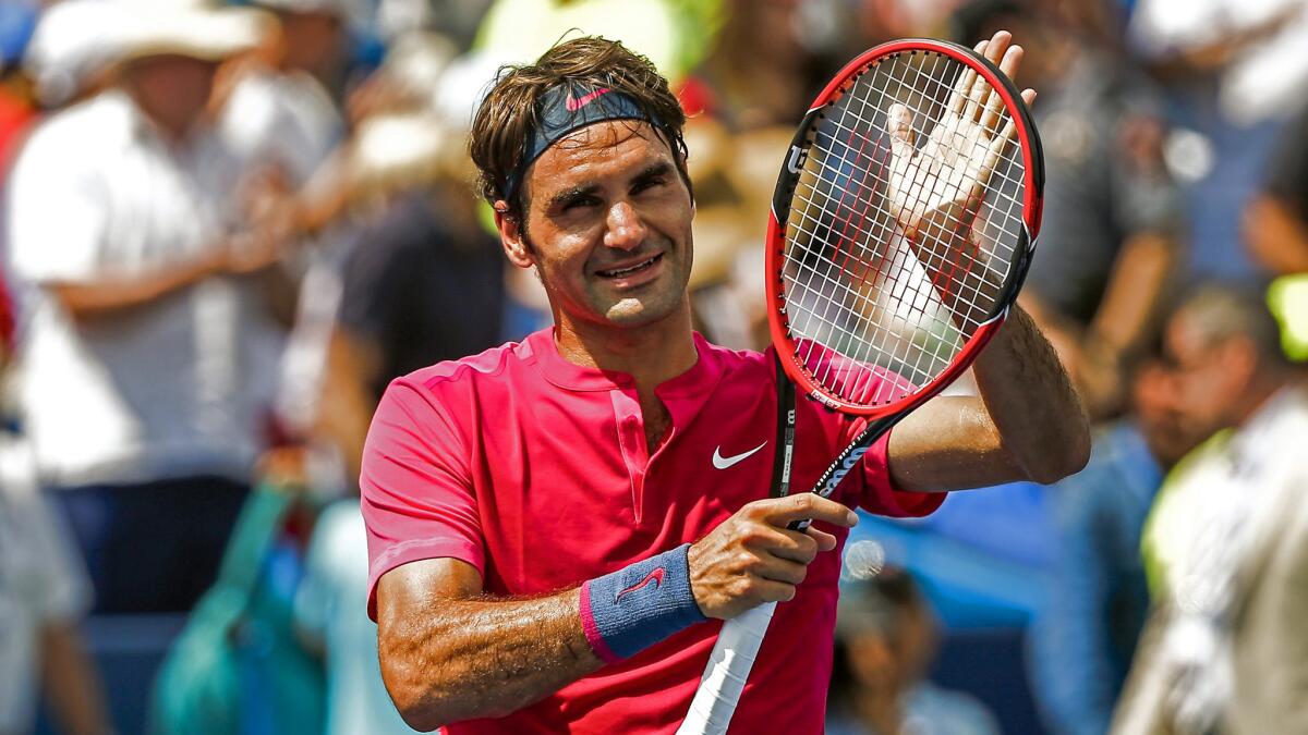 Roger Federer applauds the fans after defeating Novak Djokovic in the championship match of the Western & Southern Open on Sunday.