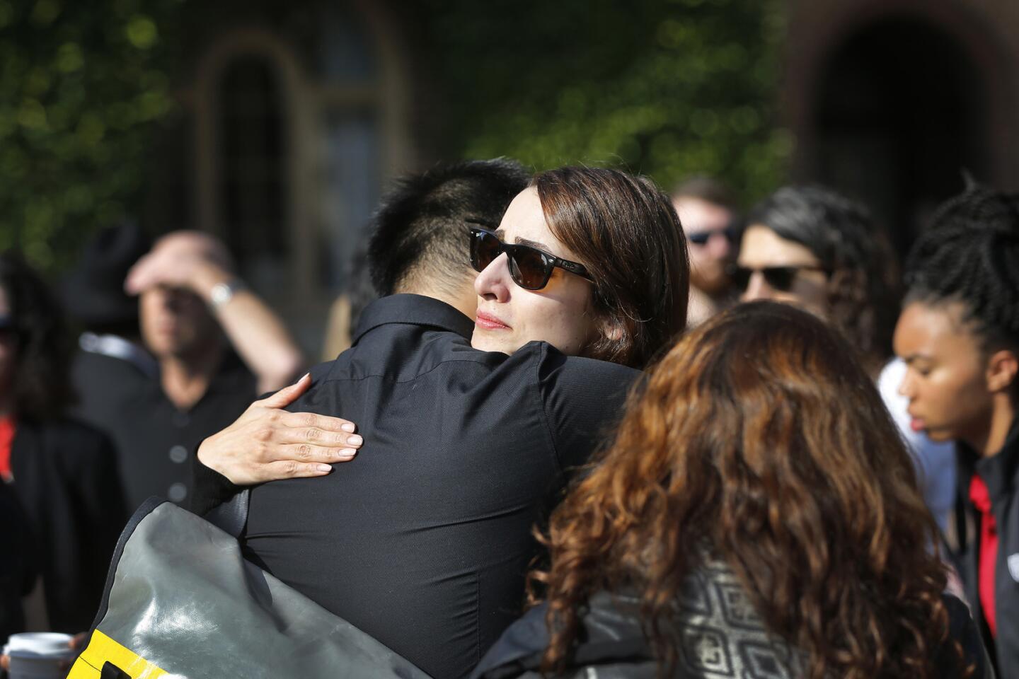 USC graduate student Helga Mayzar hugs fellow mourners after speaking at a ceremony honoringprofessor Bosco Tjan.