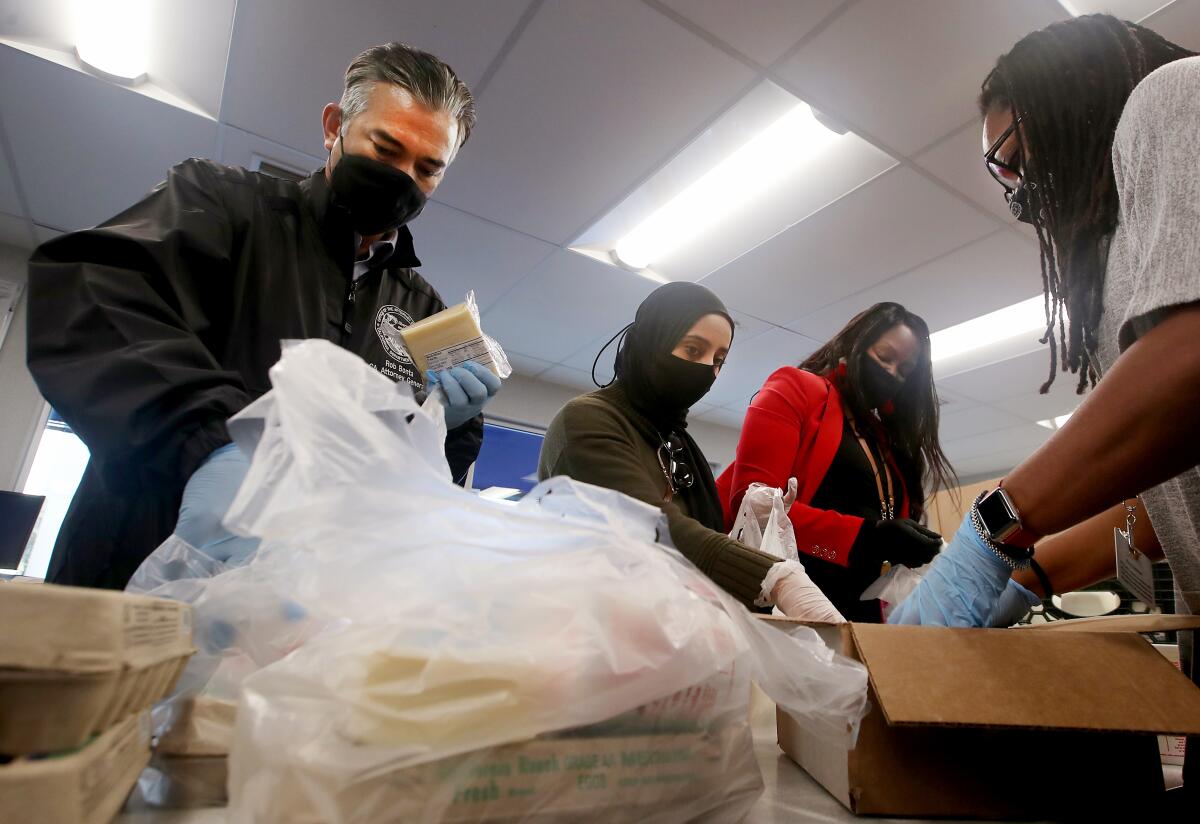 California Atty. Gen. Rob Bonta fills grocery bags