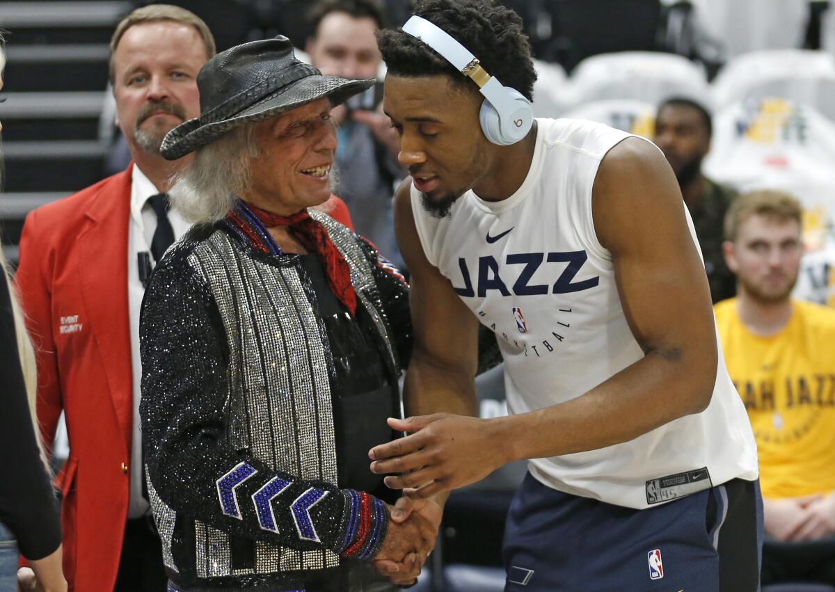 James Goldstein shakes hands with Utah Jazz guard Donovan Mitchell in 2019