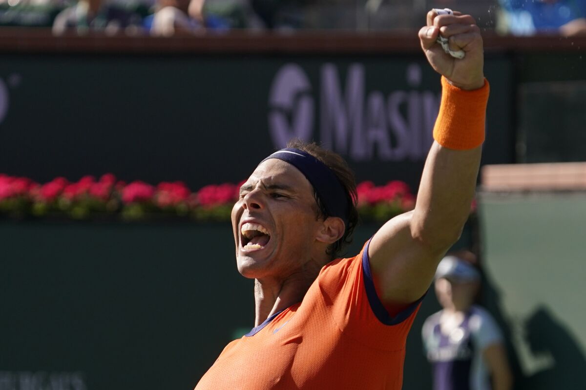 Rafael Nadal, of Spain, celebrates after defeating Reilly Opelka at the BNP Paribas Open tennis tournament Wednesday, March 16, 2022, in Indian Wells, Calif. (AP Photo/Mark J. Terrill)