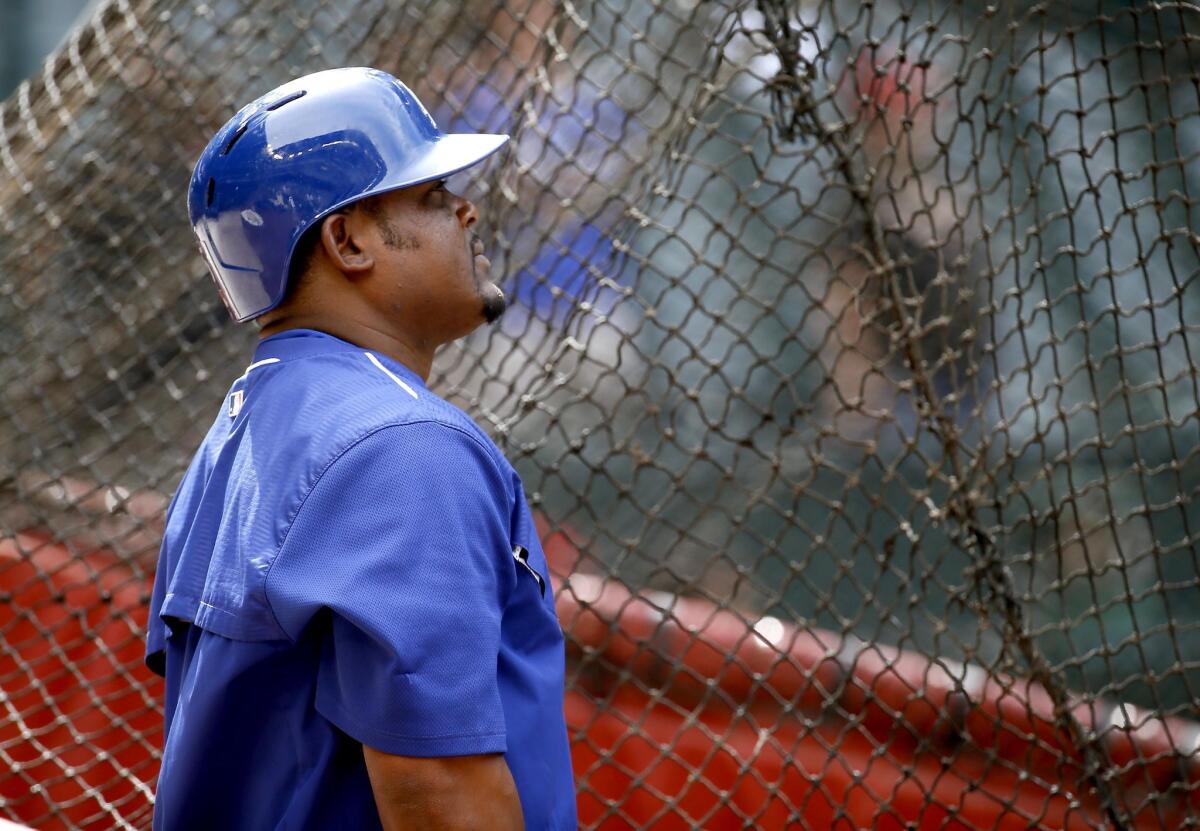 Juan Uribe takes in batting on April 11. Uribe has an 11-game hitting streak but watched from the dugout Saturday as the Dodgers opted to start Justin Turner at third base for the second game in a row.