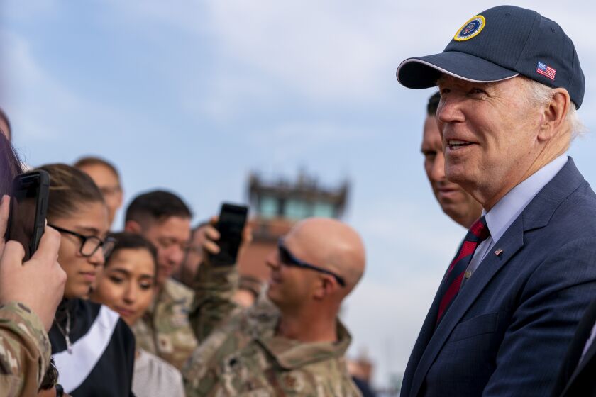 President Joe Biden speaks with guests on the tarmac as he arrives at Peterson Space Force Base in Colorado Springs, Colo., Wednesday, May 31, 2023. (AP Photo/Andrew Harnik)