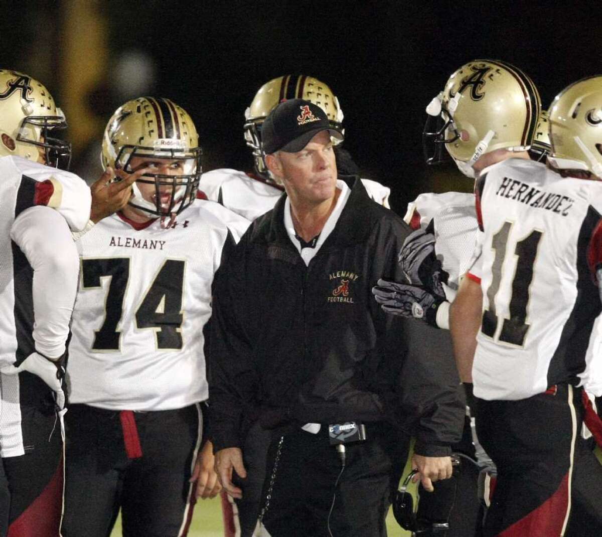 Alemany football coach Dean Herrington looks on during a game against Crespi on Oct. 22, 2010.