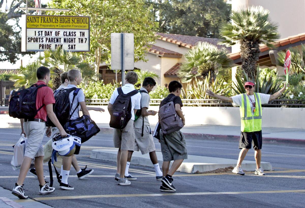 St. Francis High School students make their way to school in this 2010 file photo.