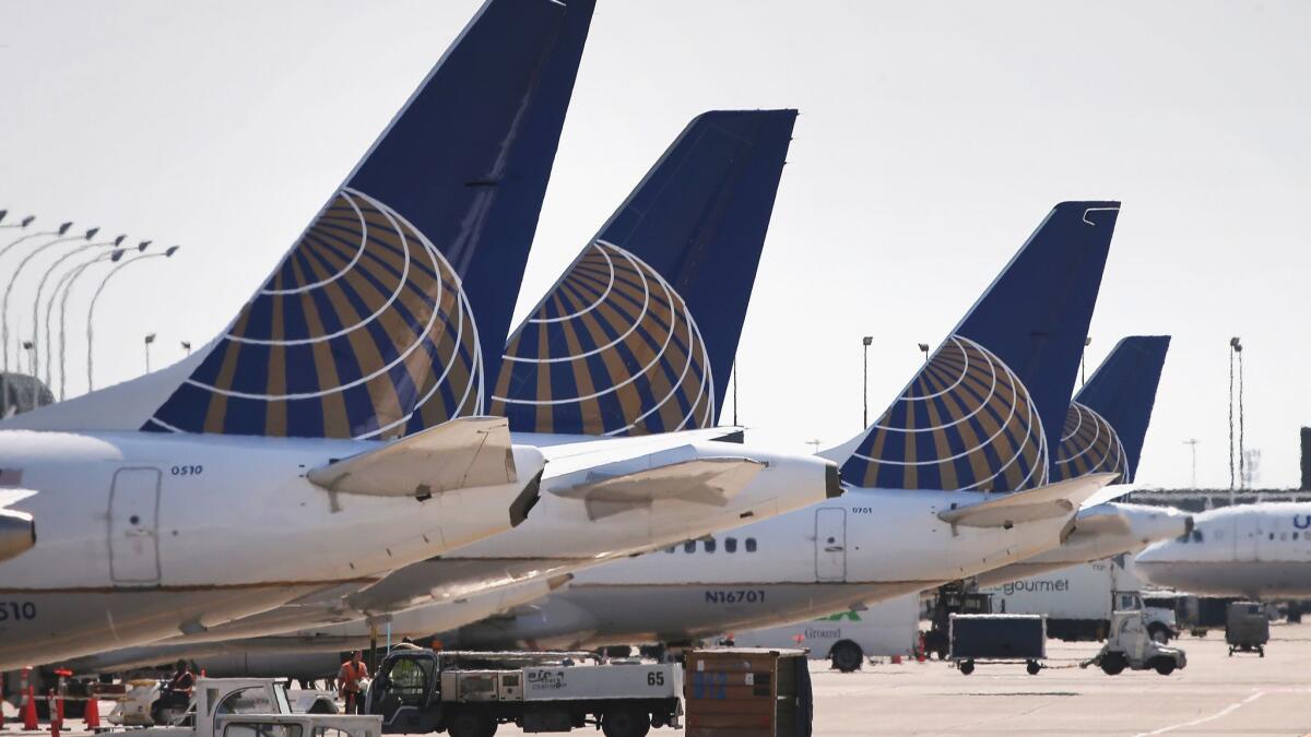 United Airlines jets sit at gates at Chicago O'Hare International Airport in 2014. United President Scott Kirby said the carrier will charge an extra fee for economy seats near the front of the plane, behind the "Economy Plus" seats.