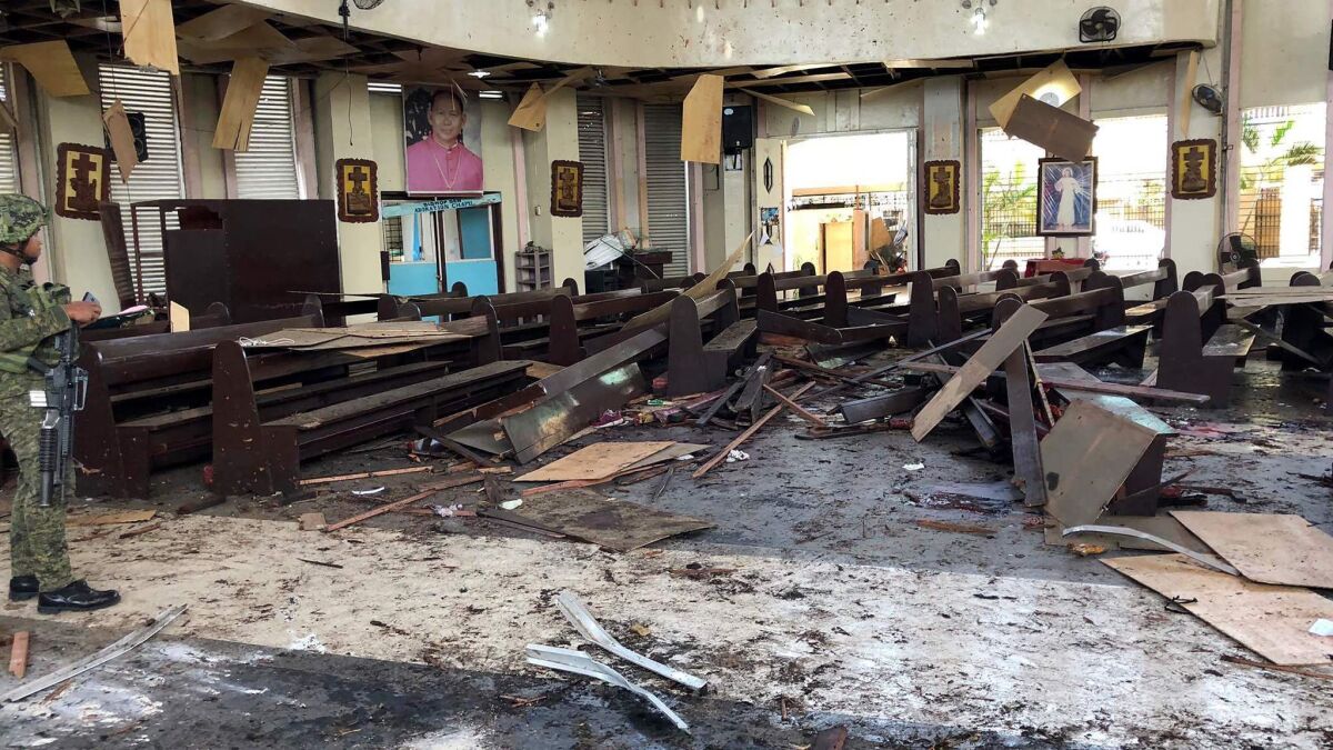 This photo released by Armed Forces of the Philippines (AFP) Public Information Office Western Mindanao Command taken on Sunday shows debris inside a Catholic church where two bombs exploded in Jolo, on the southern island of Mindanao.