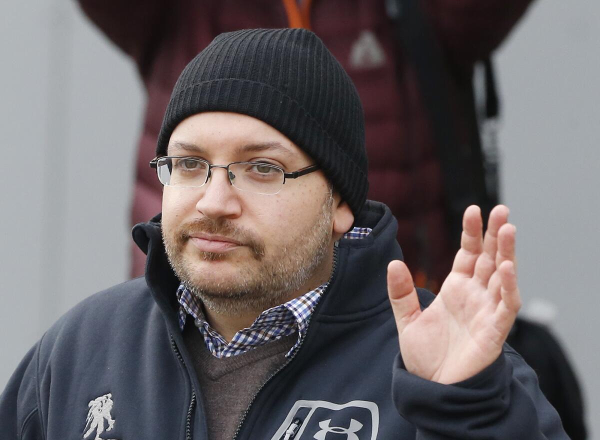 U.S. journalist Jason Rezaian waves to the media after arriving in Landstuhl, Germany, following his release from an Iranian prison on Jan. 20, 2016. (Michael Probst / Associated Press)