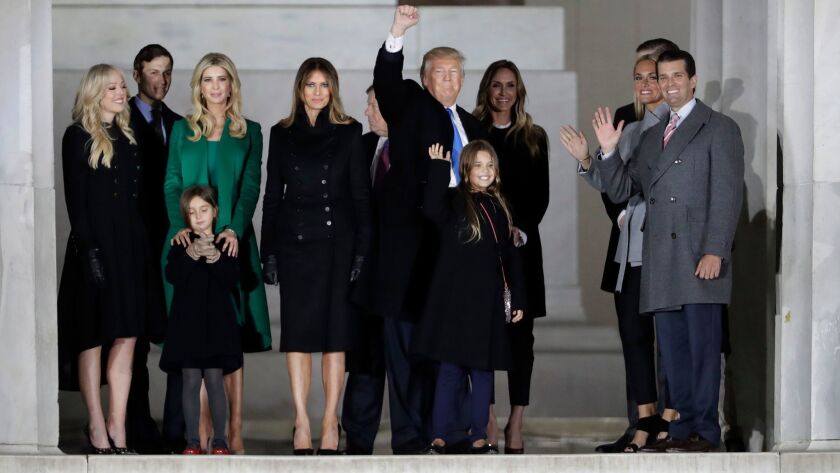 President-elect Donald Trump and his family wave at the conclusion of a pre-Inaugural event.