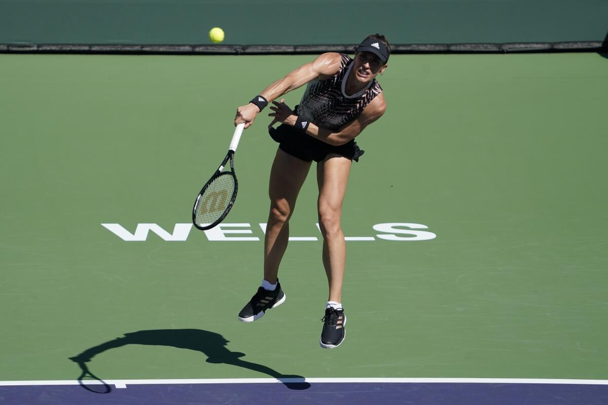 Andrea Petkovic serves to Yulia Putintseva at the BNP Paribas Open. 