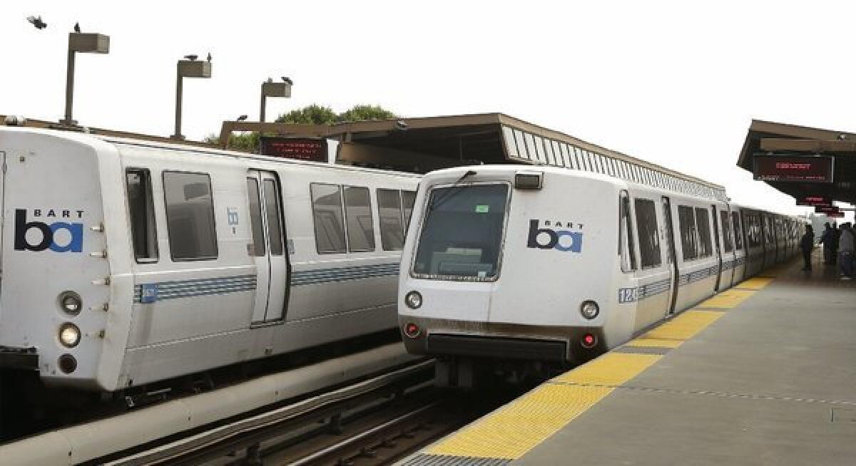 Bay Area Rapid Transit trains wait to board passengers at the Fruitvale station on Saturday in Oakland. Agency officials and labor leaders resumed talks Sunday as a midnight deadline approached for reaching an agreement to avoid a strike.