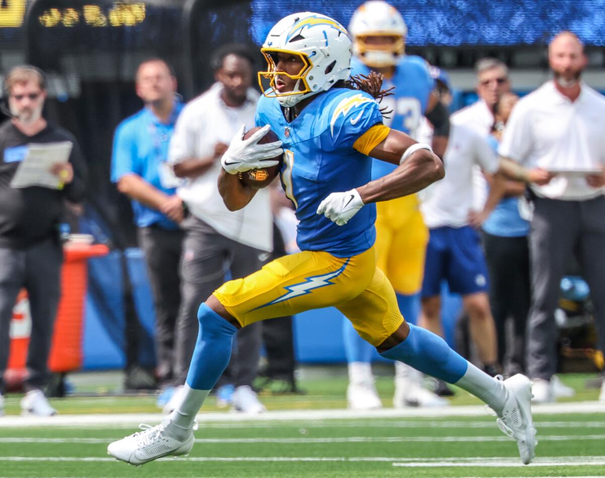 Chargers wide receiver Quentin Johnston runs after making a catch against the Raiders at SoFi Stadium on Sept. 8.