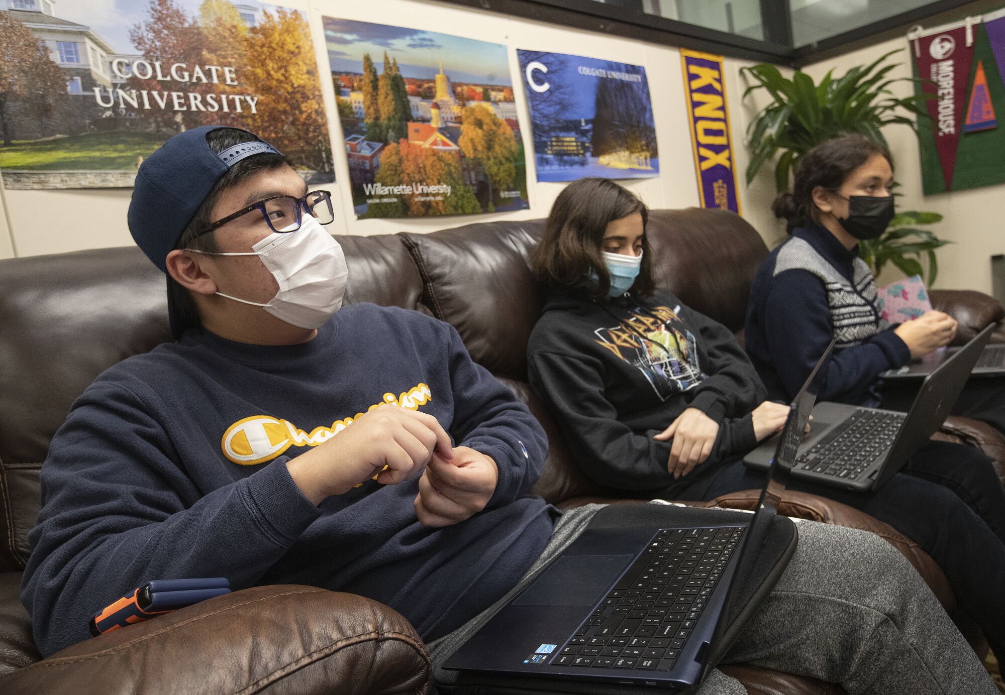 Kenji Horigome, left, a senior at Downtown Magnets High School, and other seniors inside the College Center.