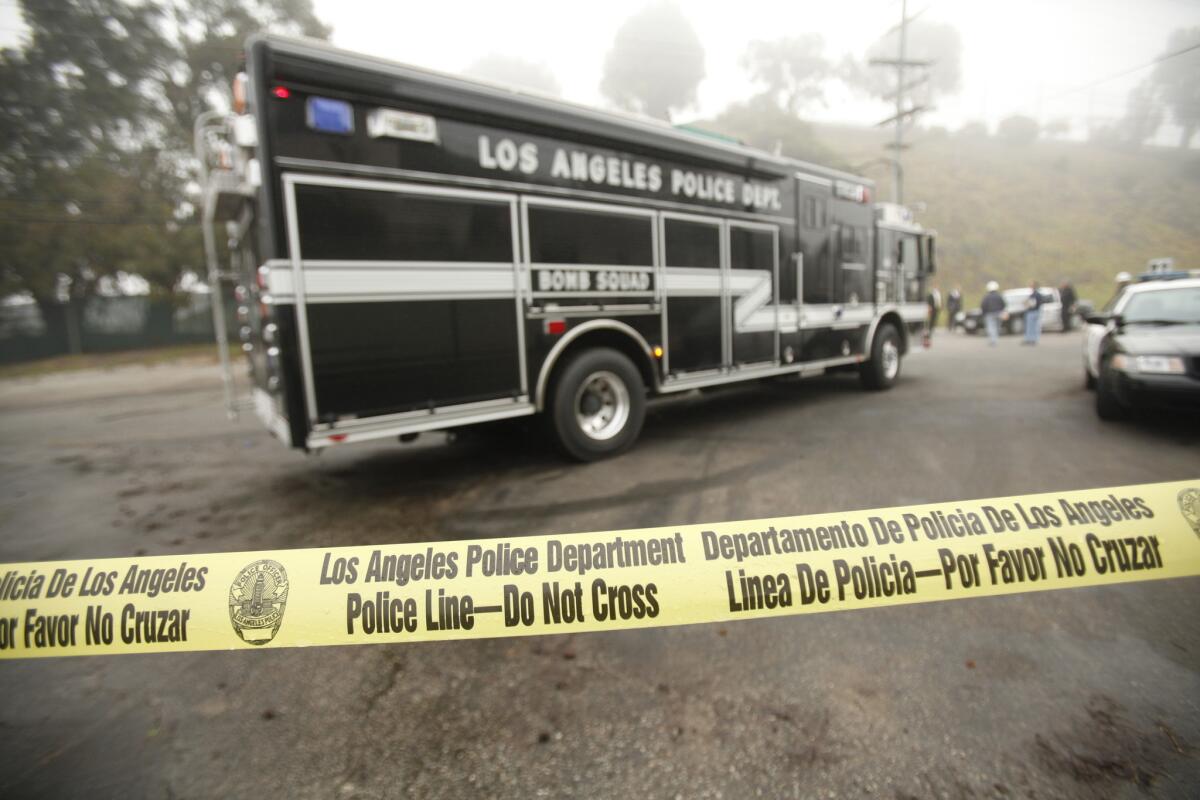 The Los Angeles Police Department bomb squad leaves the gas storage facility in Playa del Rey.