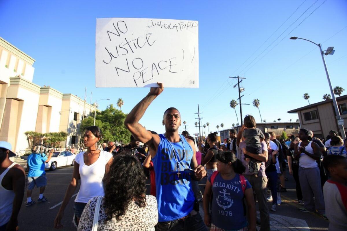 Lavell Ford joined an estimated 200 activists who marched downtown on Thursday to protest the fatal police shooting of his brother, Ezell Ford.