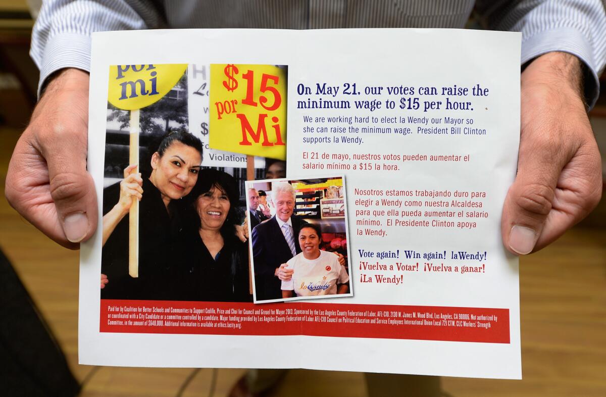 A campaign mailer sponsored in part by the Los Angeles County Federation of Labor implies that Wendy Greuel's election as mayor is key to raising the minimum wage to $15 an hour. The mailer does not clarify that the wage proposal is only for hotel workers.