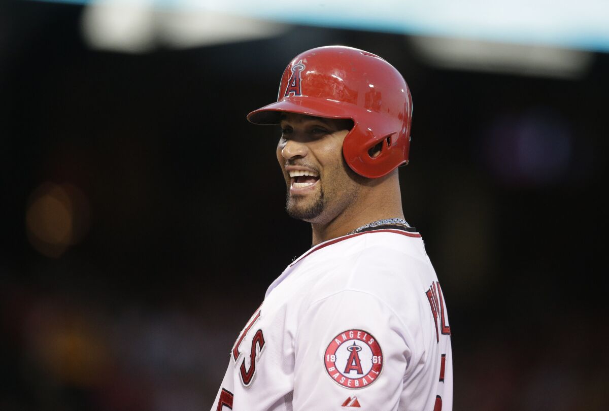 Angels slugger Albert Pujols had plenty to smile about after hitting three home runs during a doubleheader against the Red Sox and passing Mike Schmidt on the all-time home run list.