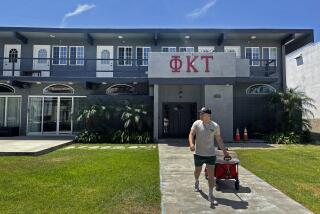 Los Angeles, California-Aug 12, 2022-Isaac Ignatius, president of Phi Kappa Tau, moves belongings from one fraternity house to a new house on 28th Street 'Frat Row' which he says is a better location for the 26 resident members. Fraternities at USC are possibly going to disaffiliating with USC because they don't want to follow extremely strict university rules on parties that were implemented last year. Phi Kappa Tau has not made that decision yet. (Carolyn Cole / Los Angeles Times)