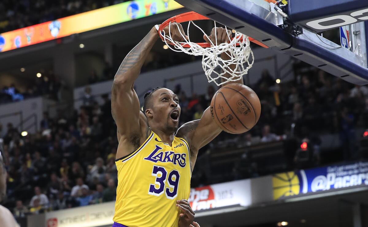 Lakers center Dwight Howard dunks during a game against the Indiana Pacers.