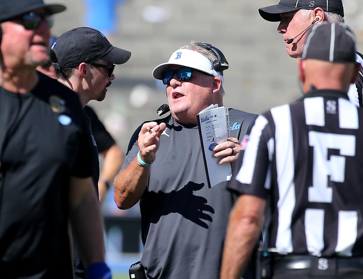 UCLA coach Chip Kelly talks with officials during a win over Washington State at the Rose Bowl on Oct. 7.